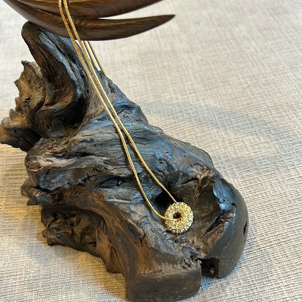 Long gold plated necklace with circular Swarovski crystals pendant. Unmarked.